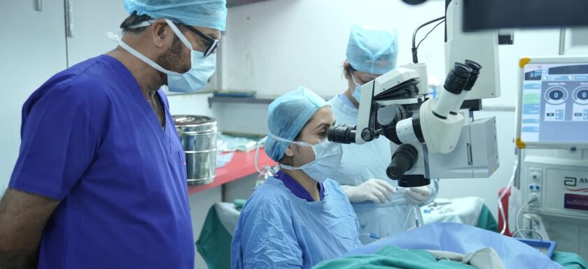 Surgeons performing eye surgery in a New Delhi hospital operating room.